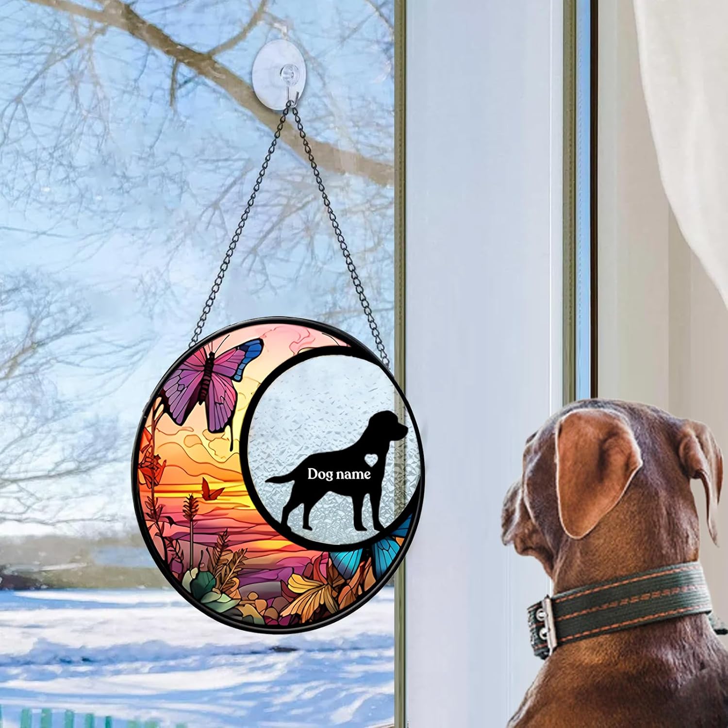 Personalized dog memorial glass suncatcher hanging in natural window light