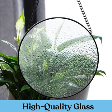 Close view of the transparent water-ripple glass surface and round metal frame