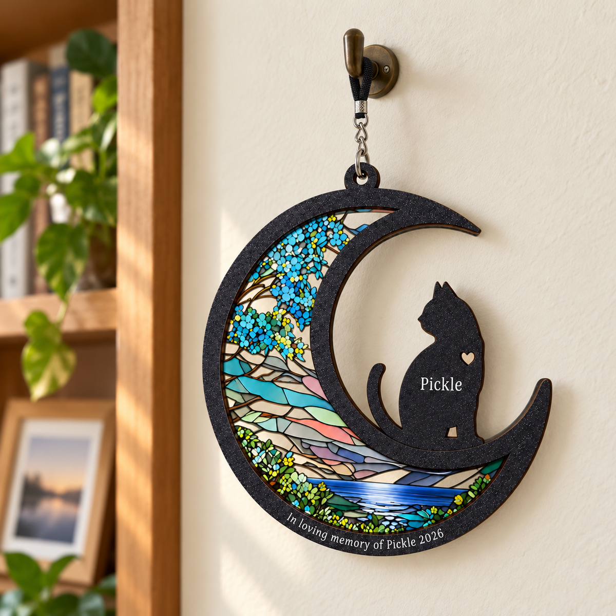 Cat memorial crescent ornament example hanging on a home hook with black nylon silver-chain hanger