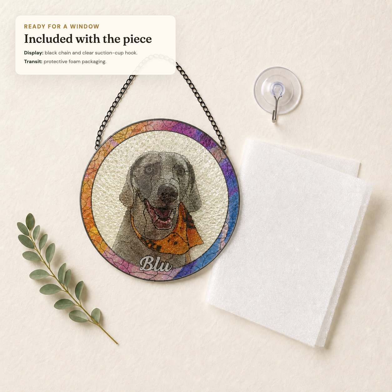 Translucent pet suncatcher with black chain, clear suction-cup hook, and protective foam packaging