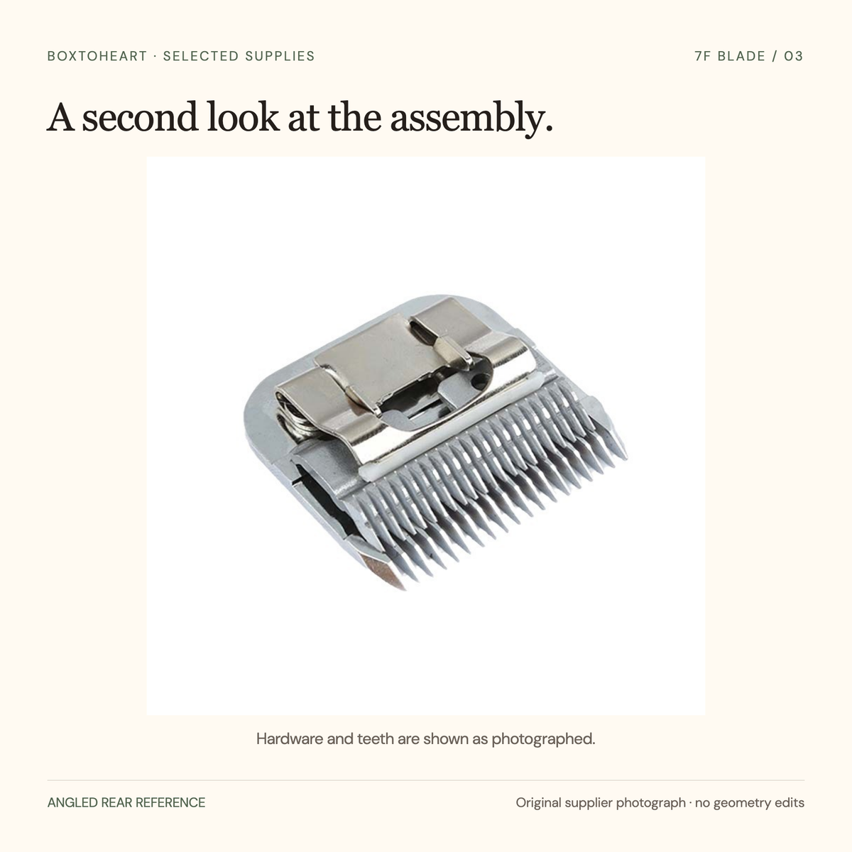 Original angled rear-view supplier photograph of a complete replacement head showing the spring mount, layered blade assembly and cutting teeth, without retouching.