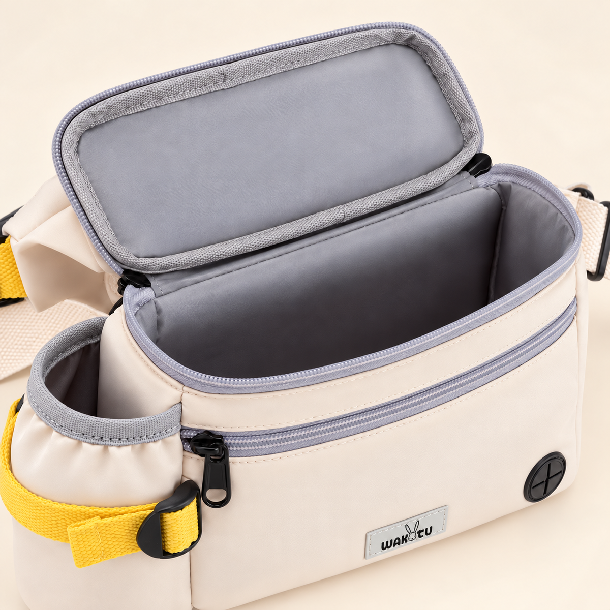 Supplier-based illustration of the open empty gray-lined compartment and ivory exterior.