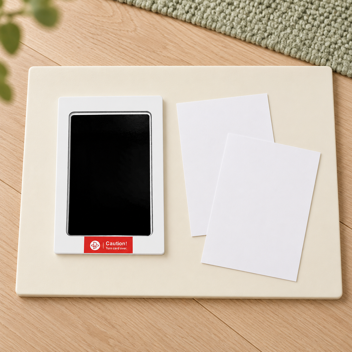 Illustrated one-unit preparation arrangement with the corresponding labeled black transfer pad, two blank cards and a firm surface; not the full bundle inventory.