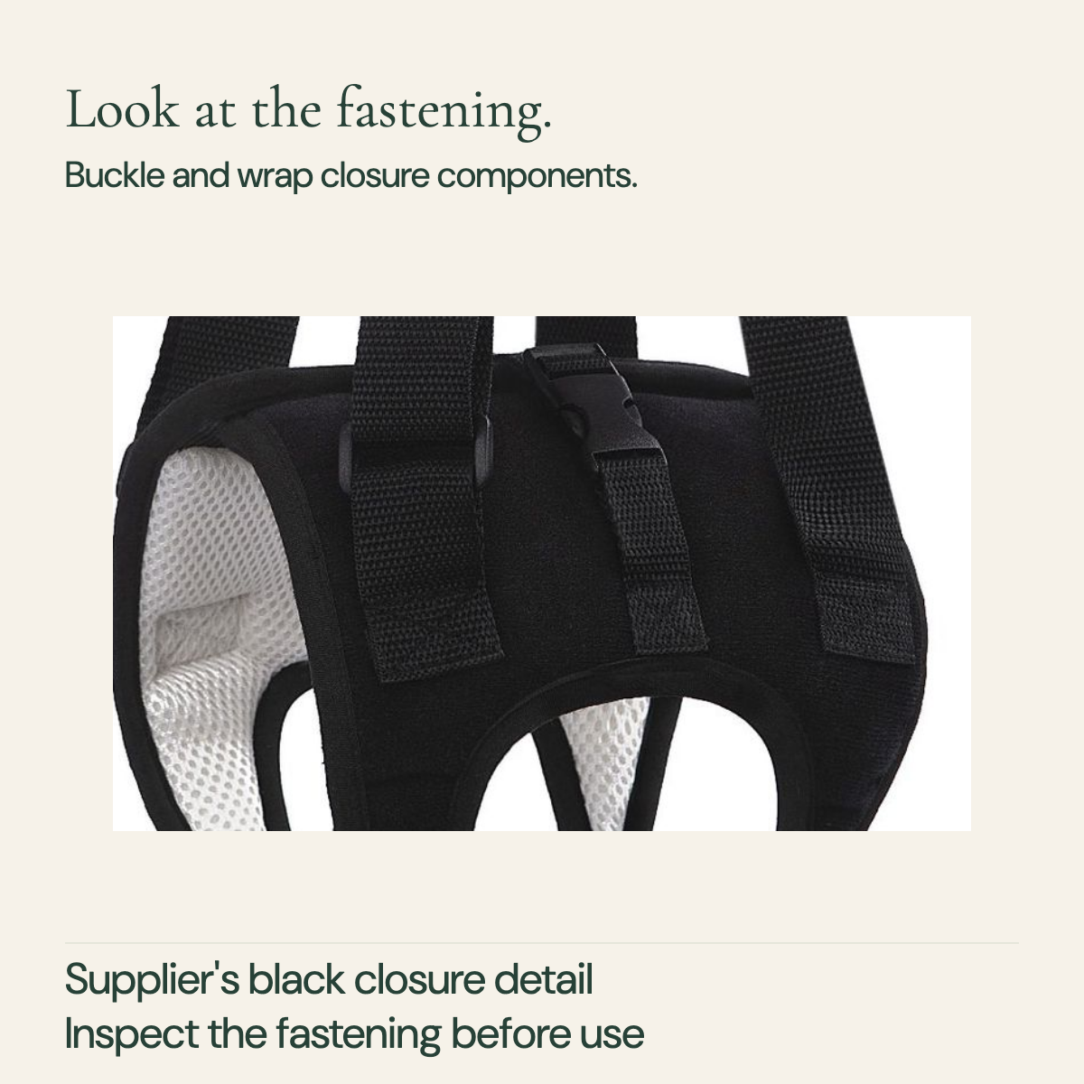 Close view of the black harness buckle, webbing attachment and wrap closure region.