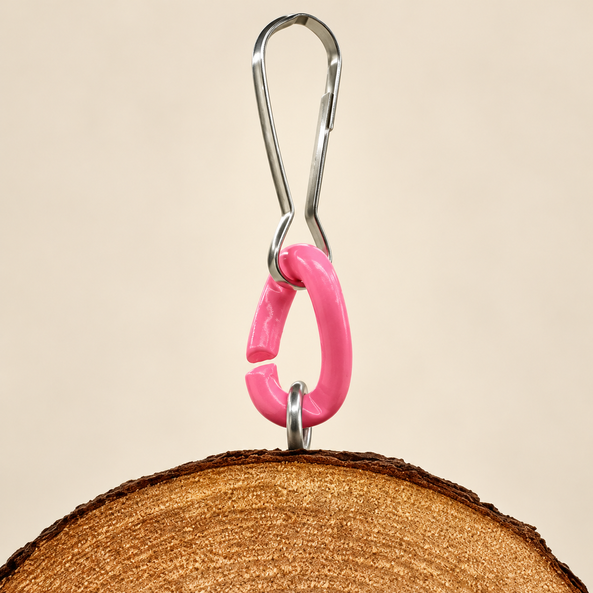 Detail of the hanging hook, open pink link and disk connector.