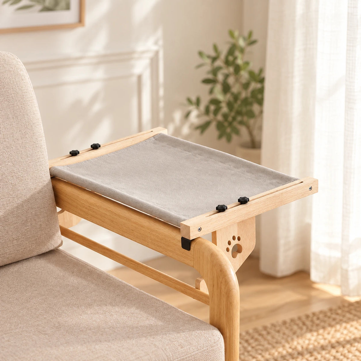 Grey fabric hook-on cat hammock with a wooden frame on a chair arm