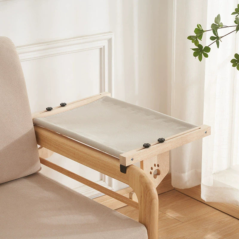 Supplier photograph of the selected grey hanging hammock configuration on a wooden chair arm