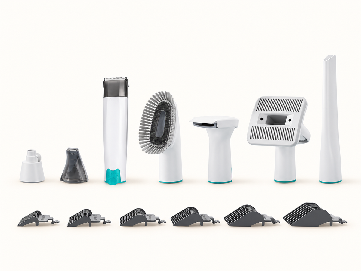 Seven grooming-tool types and six guide combs; the included vacuum base and hose are not pictured.