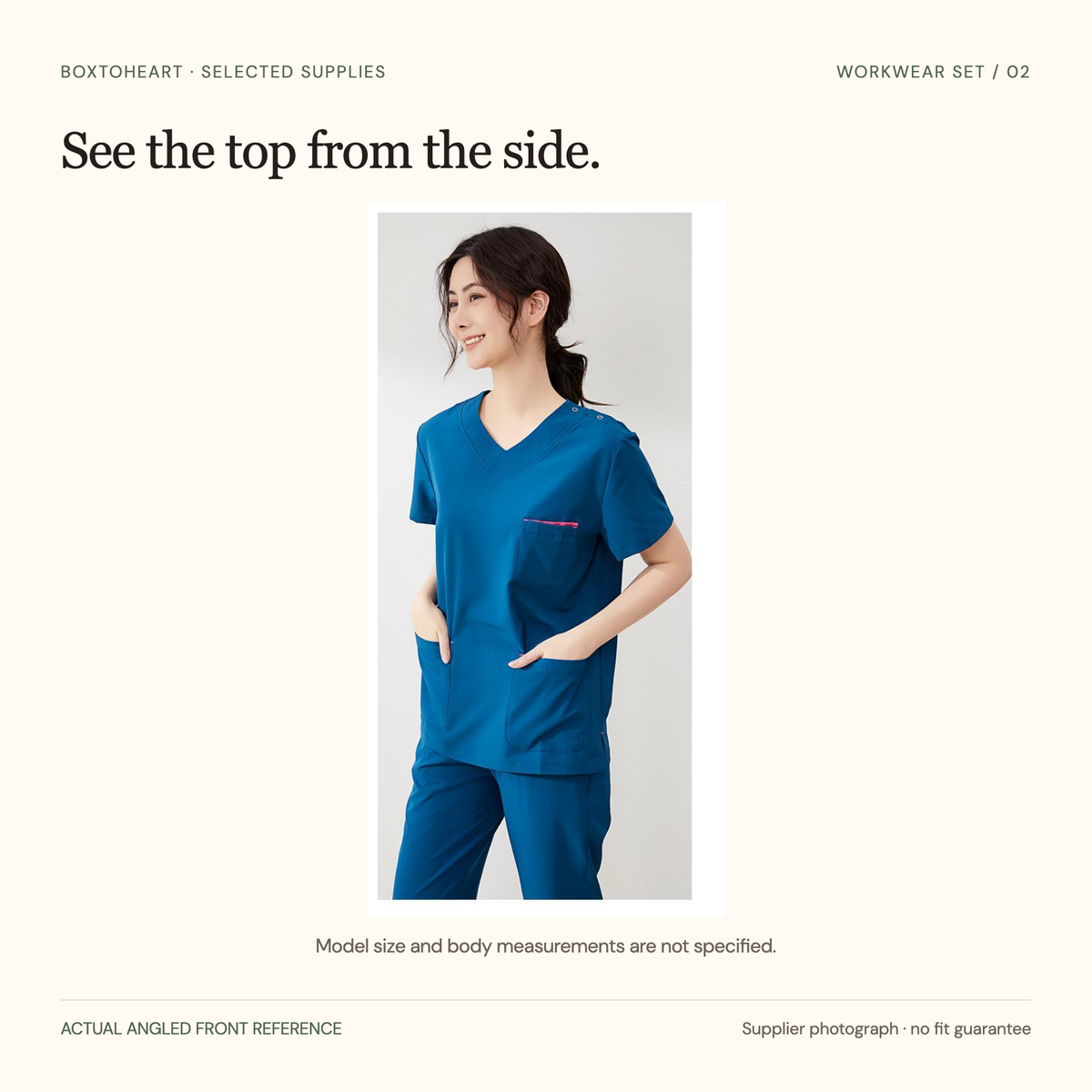 Original angled front supplier photograph of the peacock-blue short-sleeve top, with pink chest-pocket trim, shoulder buttons and lower pockets.